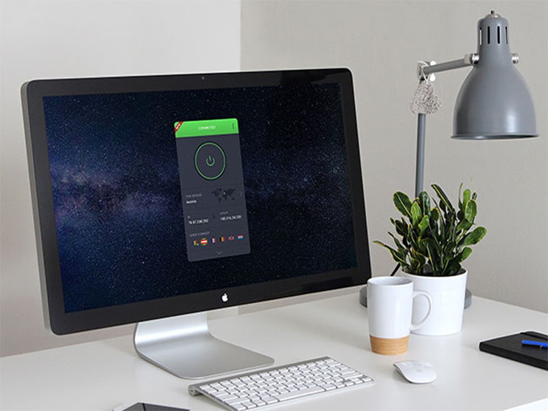 Desktop computer displaying VPN app on screen